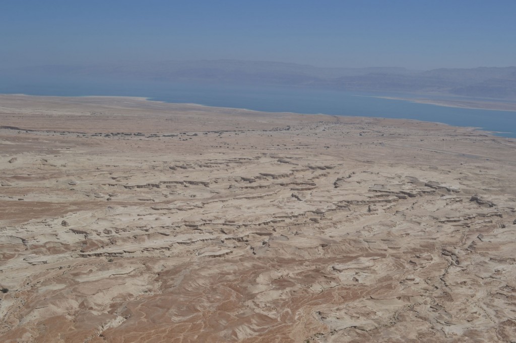 The desert is an odd place, shaped by water but very little of it around. The Dead Sea is in the background.