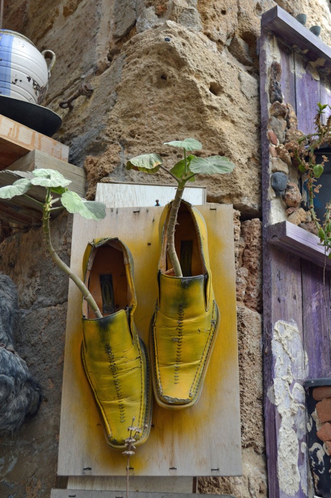 In Akko, plants grow from shoes spray painted yellow.