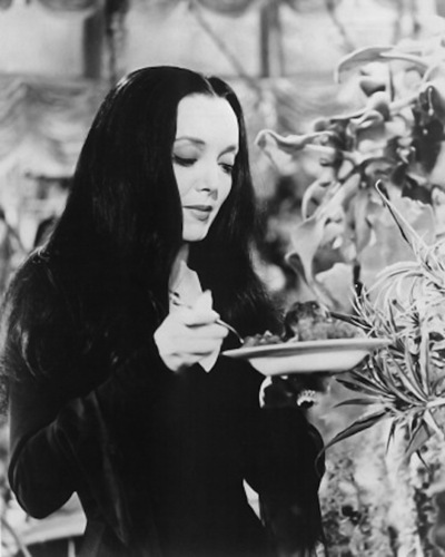 Morticia feeds her plant | Crasstalk